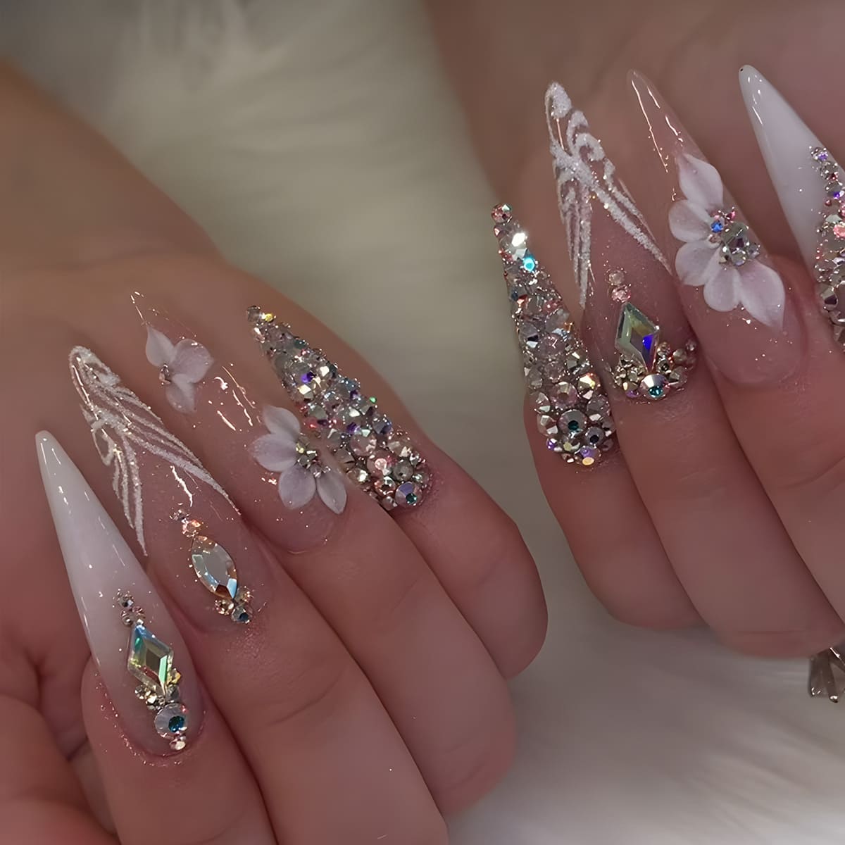 VIBEFICANT GLAZE Long Stiletto Ombre Nude Press-On Nails with rhinestones and floral designs.